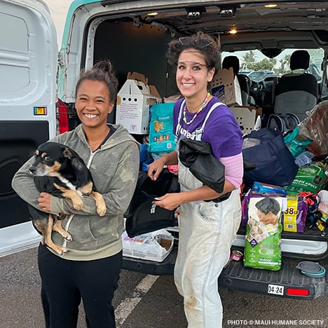 20230810_Maui_Wildfire_people_smiling_holding_dog_by_van_w_supplies_©_Maui_Humane_Society_Disaster_Relief copy