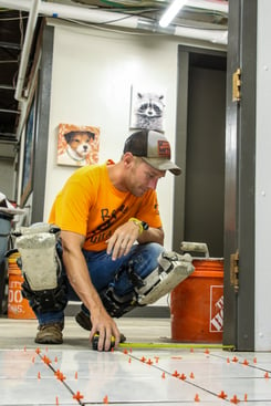 rescue rebuild team member installing new flooring