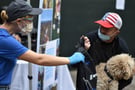 Man in American Flag Hat Holding Fluffy Dog 2_©LA Family Housing_Good Packs-2