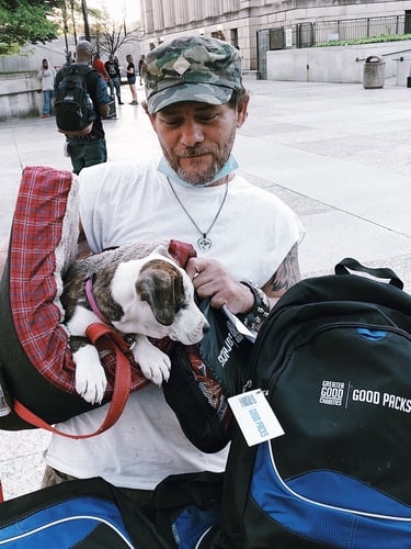 Man in Camouflage Hat with Dog and Good Pack + Pet Pack 1 at …iation_Good Packs.j