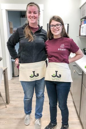 NIkki-Lowe-and-Caroline-Bruer-model-new-CP-aprons-1-23-18.jpg