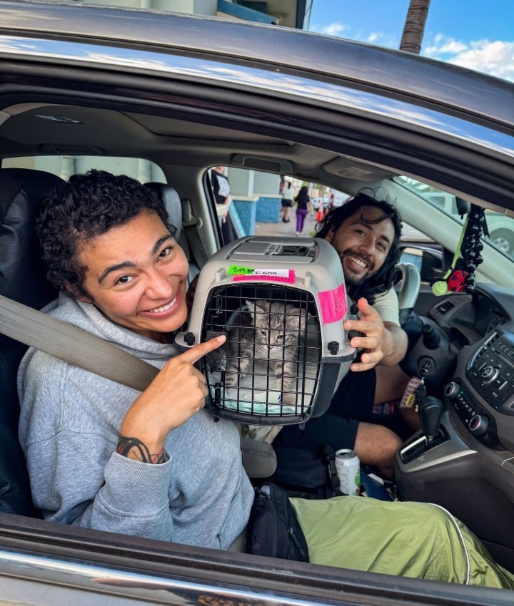 Community Members with their Cat Gertrudis, our 80,000th Spay/Neuter